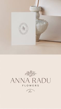 the logo for an elegant flower shop is displayed on top of a white card holder