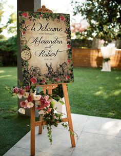 a welcome sign with flowers on it