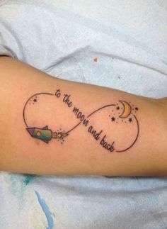 a person with a tattoo on their arm that says to the moon and back,