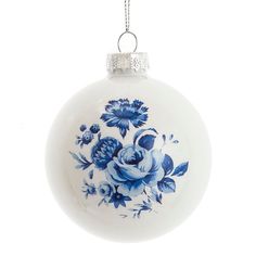 a blue and white ornament with flowers on it