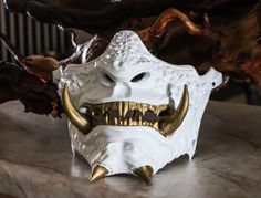 It is a 3D Printed ! Unique ! Samurai mask with amazing quality and nice graphics on it! It fits in most faces. * Tell me on the personalization if you want the rope case to be GOLD.     !  OTHERWISE IT WILL BE WHITE  ! - It can come also with an elastic band. (Wearable) -or it can come as a decorative mask for the house.(Decorative) What? Samurai masks, called mempo, were facial armor worn by Japanese Samurai warriors. They were made out of leather and iron and were designed not only to protect Oni Half Mask, Samurai Masks, Mempo Mask, Hannya Maske, Masque Hannya, Samurai Style, Samurai Mask, Special Forces Gear, Hannya Mask