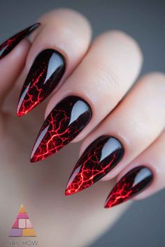 Red Lava: Bring the heat with these lava-inspired nails! The fiery red cracks on a black base create a smoldering effect that’s perfect for a dramatic Halloween look. Great for anyone who loves a bold and fiery style. Visit nailhow.com for more hot Halloween nail art ideas and save this pin for your next salon visit! 🔥🖤 Fire Acrylic Nails Art Designs, Pretty Natural Nails Ideas, Halloween Art Nails, Cracked Nail Art, Lightning Nails Acrylic, Black Red Halloween Nails, Red And Black Chrome Nails, Swirl Nail Art Designs, Halloween Coffin Nail Ideas