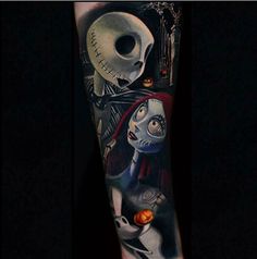 a person with a tattoo on their arm next to a skeleton and jack skellingy