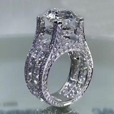 an intricately designed diamond ring on display