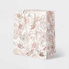 a paper bag with flowers on it