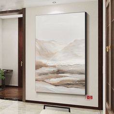 a painting hanging on the wall in a living room