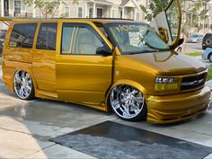 a gold van parked in front of a house