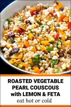 roasted vegetable pearl couscous with lemon and feta in a white bowl on a blue background