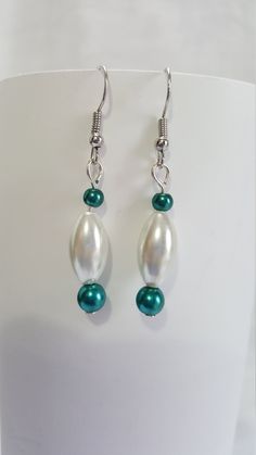 These simple but elegant earrings and the perfect completion for a night out. Turquoise Pearl Drop Earrings, Elegant Turquoise Pearl Drop Earrings, Elegant Handmade Turquoise Hoop Earrings, Elegant Turquoise Hoop Earrings, Elegant Green Nickel-free Clip-on Earrings, Turquoise Drop Earrings For Formal Occasions, Nickel-free Elegant Beaded Earrings, Elegant Nickel-free Beaded Earrings, Turquoise Earrings For Evening