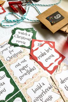 several christmas movie tickets sitting on top of a table next to some candy canes