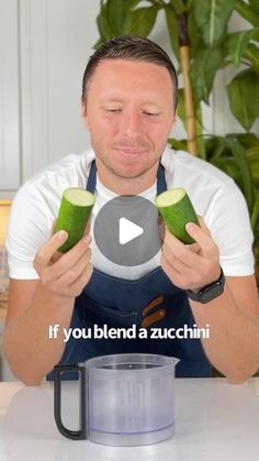 a man holding cucumbers in front of a blender with the words if you blend a zucchini