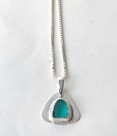 Sea glass jewelry Many people have fond memories of the sea.  Maybe it is fun days at the beach with their family.  Or maybe it is long walks on the beach in search of beach treasures.  Whatever your fond memory of the sea might be, this light teal sea glass necklace would be a beautiful keepsake of your memory.  It would also be a elegant gift for a daughter. The genuine sea glass is nestled in a setting of fine silver.  The sea glass pendant is completed with a sterling silver bail and a sterl Walks On The Beach, Silver Gift Box, Sea Glass Pendant, Sea Glass Necklace, Light Teal, Silver Work, A Daughter, Gift For Daughter, Sea Glass Jewelry