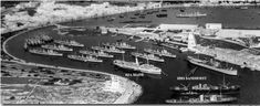 an aerial view of several ships in the water