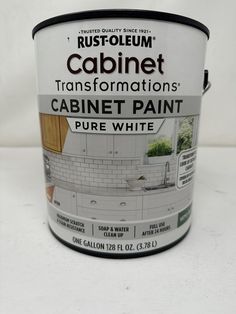 a can of white paint sitting on top of a table