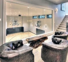 a living room filled with furniture and a staircase