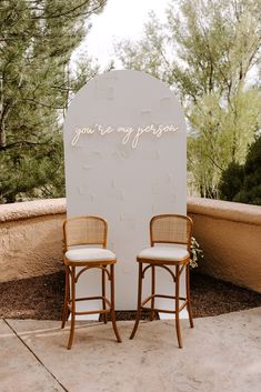 two chairs sitting in front of a sign that says you're my person