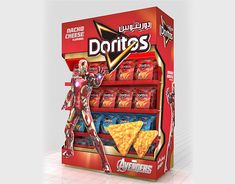 a display case for doritos with iron man figure next to it and chips