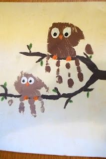 a child's drawing of an owl and her baby sitting on a tree branch