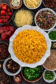 many bowls filled with different types of food