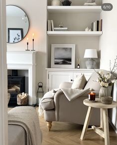 a living room filled with furniture and a fire place