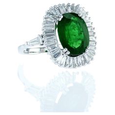 Hallmarked Oval Emerald Ring In Platinum, Oval Hallmarked Emerald Ring In Platinum, Exquisite Oval Emerald Ring In Platinum, Gia Certified Oval Rings For Formal Occasions, Luxury Marquise Emerald Ring, Luxury Oval Emerald Cluster Ring, Formal Polished Platinum Emerald Ring, Formal Platinum Emerald Ring With Polished Finish, Luxury Oval Halo Ring For Formal Occasions