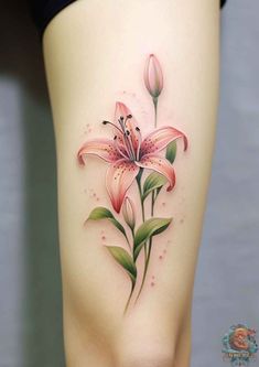 a woman's thigh with a pink flower tattoo on her thighs and the bottom part of her leg