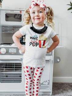 Girls Valentine's Day Shirt Pop, pop, hooray! Our Girls Valentine's Day Shirt is here to add a dash of fun to the celebration. With an adorable 'You Make my Heart Pop' design, this shirt is popping with love and style. A playful choice for your little popcorn lover! 🍿💖 Details 100% cotton white; short + long sleeve lengths unisex, kids fit heat transfer apparel decorating method made in Philadelphia, PA by a certified woman-owned, black-owned, small business Processing Time Orders are processe Fun Cotton T-shirt For Playdate, Playful Tops With Funny Print For Playtime, Playful Crew Neck Tops For Playdate, Trendy Letter Print Tops For Playtime, Cotton Graphic Print Top For Playdate, Playful Short Sleeve T-shirt For Playdate, Cute Short Sleeve Tops For Playdate, Cute Cotton T-shirt For Playdate, Heat Transfer Design