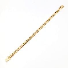 This Cuban link bracelet is crafted in 14 Karat yellow gold. Measuring 6.5mm wide, 7 inches long and with a box clasp/figure 8 safety. Elegant Cuban Link Bracelet With Solid Construction, Classic Cuban Link Bracelet With Jubilee Details, Classic Cuban Link Diamond Bracelet, Classic Cuban Link Jubilee Bracelet, Classic Gold Chain Cuban Link Bracelets, Classic Gold Bangle Bracelet With Curb Chain, Classic Gold Curb Chain Bangle Bracelet, Luxury 14k Gold Bracelets With Curb Chain, Luxury 14k Gold Bracelet With Curb Chain