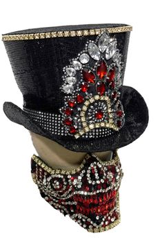 This is limited edition 2 pcs set Top hat and half face mask by SteamEra Production Hand made Black sequins burlesque look Top Hat with hand stitched jewels details at front with black and white stones at the base of hat ribbon. Mask has 2 adjustable straps, it has a 4 buckles and can be tightened to adjust to most heads and inside is fully lined and has sponges for comfortable fit.  please refer to photos. This is hand made and it is very well made. This hat is made of black sequences Fabric and inside of the hat is fully lined. The front of hat and mask has Brass look diamanté edging all around the details. This Top hat  has lots of details please refer to photos. SIze Available 55cm Mask is available in one size only . Thank you for looking High Crown Top Hat For Carnival, Carnival Adjustable Top Hat With High Crown, Adjustable High Crown Top Hat For Carnival, Fitted Costume Hats For Carnival Masquerade, Fitted Masquerade Costume Hats For Carnival, Sequence Fabric, Alice In Wonderland Props, Sequins Top, Black Sequin Top