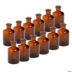 brown glass bottles are lined up in a row