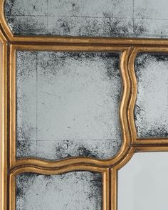 an old mirror with moldy paint on the glass and wood frame is shown in this image