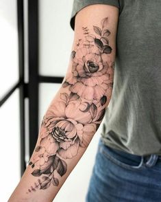 a person with a flower tattoo on their arm