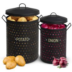 two black containers filled with potatoes next to some onions and radishes on a white background