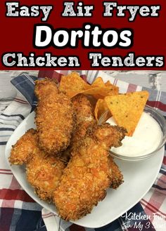 fried chicken tenders on a white plate with ranch dressing and tortilla chips