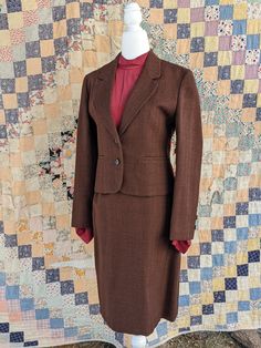 "Beautiful woman's tailored skirt and Blazer set. This 100% wool suit is in perfect condition.  Made in the USA Measurements taken flat  Jacket  Bust 17\"  Waist 16\" Torso 19\"  Shoulders 15½\" Sleeve length 22\"  Skirt  Length 22½\"  Waist 13\" Hips 18¼ \"" Tailored Single-breasted Office Lady Skirt Suit, Fitted Business Skirt Suit With Suit Collar, Fitted Skirt Suit With Suit Collar For Business, Professional Tailored Single Breasted Skirt Suit, Fitted Single Breasted Skirt Suit For Office Wear, Fitted Single-breasted Skirt Suit For Office Wear, Classic Tailored Long Sleeve Skirt Suit, Fitted Skirt Suit With Notch Lapel For Semi-formal Occasions, Fitted Notched Skirt Suit For Semi-formal