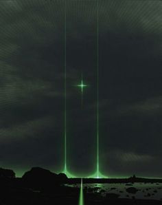 an image of a cross in the sky with green light coming from it's sides