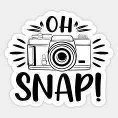 a sticker with the words oh snap and a camera in black ink on a white background