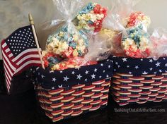 two baskets filled with popcorn and an american flag