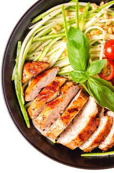 a plate filled with meat and vegetables on top of a table