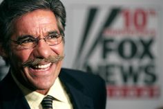 an older man with glasses and a mustache smiles at the camera in front of a fox news sign