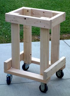 a wooden cart sitting on top of a sidewalk