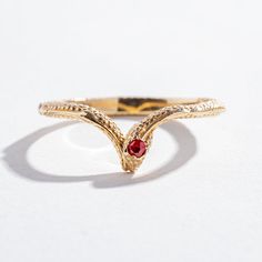 Details A dainty solid 14k yellow, 14K white, or 14K rose gold ring measuring at 2.25mm in thickness and textured throughout the outside of the band. A 2mm ruby is set on top of the snake's head. Please note, this item is made to order just for you and will take 4-6 weeks to be delivered. Elegant White Gold Snake-shaped Rings, Gold Fine Jewelry Snake-shaped Ring, Unique Yellow Gold Snake-shaped Ring, Unique Gold Snake-shaped Rings, Adjustable Yellow Gold Snake-shaped Ring, Serpent Ring, Chevron Ring, 14k Rose Gold Ring, White Diamonds