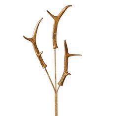 three branches with leaves on them are shown against a white background and the stems have been made out of brass