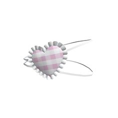 a pink and white checkered heart shaped object