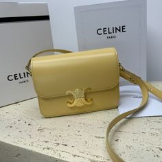 TEEN TRIOMPHE calfskin handbag
TRIOMPHE small bag in satin calfskin with an adjustable leather shoulder strap and exclusive TRIOMPHE buckle
TRIOMPHE brass lock
Internal zip pocket and internal flat pocket
Adjustable leather shoulder strap drops 17 inches (42 cm)
7 X 6 X 2 inches (18.5 X 14 X 6 cm) Luxury Yellow Calf Leather Bags, Evening Yellow Shoulder Bag With Branded Hardware, Elegant Yellow Leather Flap Bag, Elegant Yellow Crossbody Flap Bag, Elegant Yellow Flap Bag With Detachable Strap, Elegant Tan Shoulder Bag With Turn-lock Closure, Celine Teen Triomphe, Lv Purse, Lv Shoes