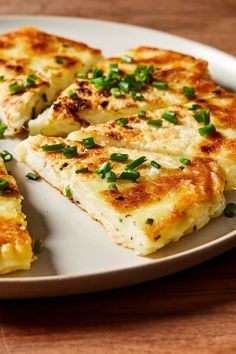 some food is on a white plate on a wooden table and ready to be eaten