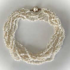 Gorgeous Four Strand 6mm Cream-White Baroque Freshwater Pearl 32" Necklace with Gold Tone Pearlized Faux Pearl Cabochon Box Clasp The Pearls Have a Lovely Cream - White  Colour and Beautiful Pearlized Lustre 4 Strands of Lustrous Pearls with a Domed Pearlized Faux Pearl Cabochon Box Clasp Necklace Measures 32" Long x 3/4" Wide More Beautiful in real time! Pearls Measure Approx 6mm Gold Tone Pearl Cabochon Box Clasp Measures 5/8" in Diameter Necklace Weighs 83 Grams New Vintage From the 1980's COMPLIMENTARY DOMESTIC SHIPPING Luxury White Double Strand Pearl Necklace, Antique Pearl Chain Jewelry For Formal Occasions, Classic White Jewelry With Polished Beads, Classic White Pearl Necklace, Luxury White Double Strand Necklace, Classic Pearl White Multi-strand Necklaces, Formal Double Strand Polished Beads Jewelry, Classic Multi-strand Pearl White Necklace, Classic Multi-strand Pearl White Necklaces