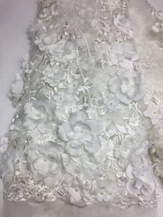 we offer a variety of fashion handmade fabric，those are widely use for wedding dress，garment and fashion cloth. we sell it by yard，our minimum order is 1 yards，and we always package it 15 yards for one roll，the width is 125cm/45 inch Material ： mesh ，Rayon,polyester. Symmetrical embroidery floral pattern, with lovely flowers in the middle, scalloped border. You can also cut and use separately. Perfect for dress, tops, wedding veil. You can split the piece up and have one scalloped edge around th White Tulle Fabric With 3d Lace Embroidery, White Lace Tulle Fabric With 3d Embroidery, Scalloped Border, Bridal Lace Fabric, Dress Tops, Wedding Lace, Embroidery Floral, Lace Flower, Handmade Fabric