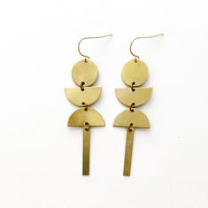 Brass Earrings, No. 30 Hooks are gold fill and even ok for sensitive ears. These modern, bold statement earrings are perfect for any occasion. They are great for work but can also be dressed up to make a big impact that completes your look! Brass oxidizes over time, meaning it will change the more you wear it to give it that beautiful aged look. You can also polish them to their original shine very easily with many home remedies or polishing cloths. Avoid wearing them in the shower to keep them Gold Geometric Earrings For Everyday, Minimalist Cadmium-free Dangle Earrings, Modern Brass Earrings For Everyday, Modern Everyday Brass Earrings, Everyday Cadmium-free Brass Earrings, Modern Gold Nickel-free Linear Earrings, Modern Dangle Earrings With French Hook, Adjustable Modern Earrings In 14k Gold Filled, Modern Brass Drop Earrings