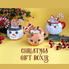 three ceramic christmas mugs sitting next to each other on a yellow background with the words christmas gift boxes